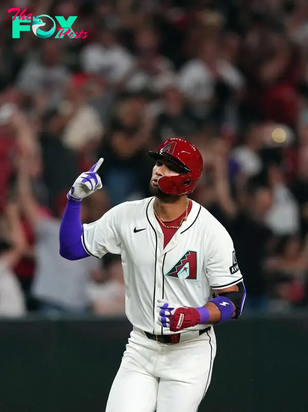 Mar 28, 2024; Phoenix, Arizona, USA;  Arizona Diamondbacks left fielder Lourdes Gurriel Jr. (12) runs the bases after hitting a two run home run against Colorado Rockies starting pitcher Kyle Freeland (not pictured) during the first inning at Chase Field. Mandatory Credit: Joe Camporeale-USA TODAY Sports