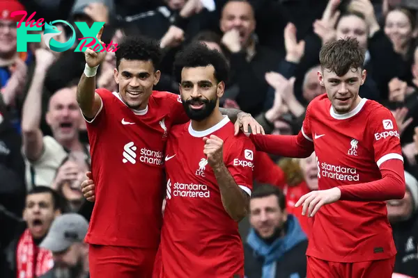 Salah is congratulated by his team-mates