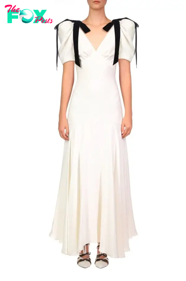 Rodarte white gown with black velvet ribbons hanging from shoulders.