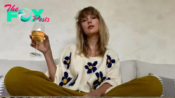 Taylor Swift drinking wine. 