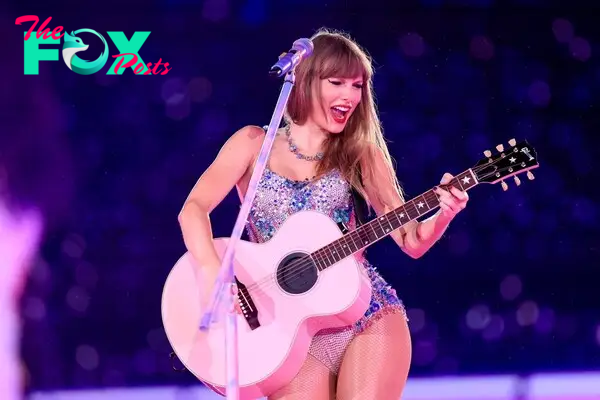 Taylor Swift performing on stage. 