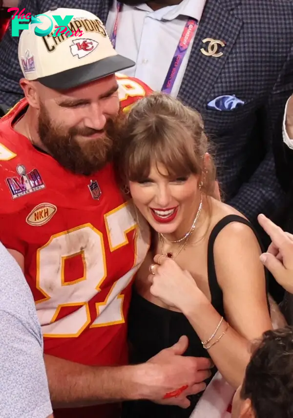 Travis Kelce and Taylor Swift hugging. 