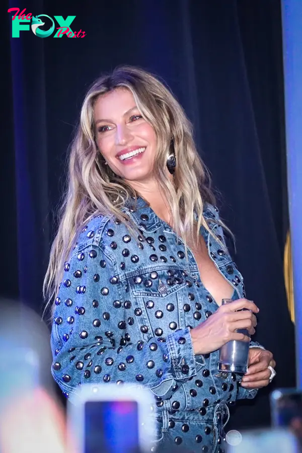 Gisele Bündchen smiling in a denim outfit