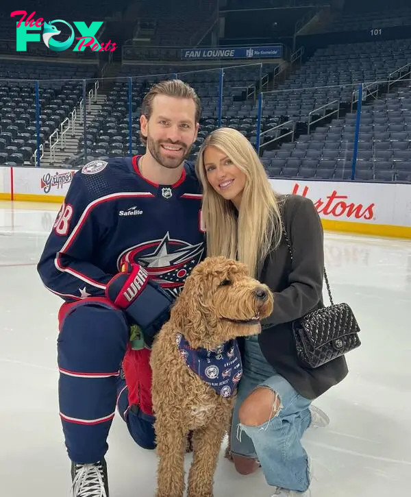 boone jenner, maggie jenner and their dog on the ice