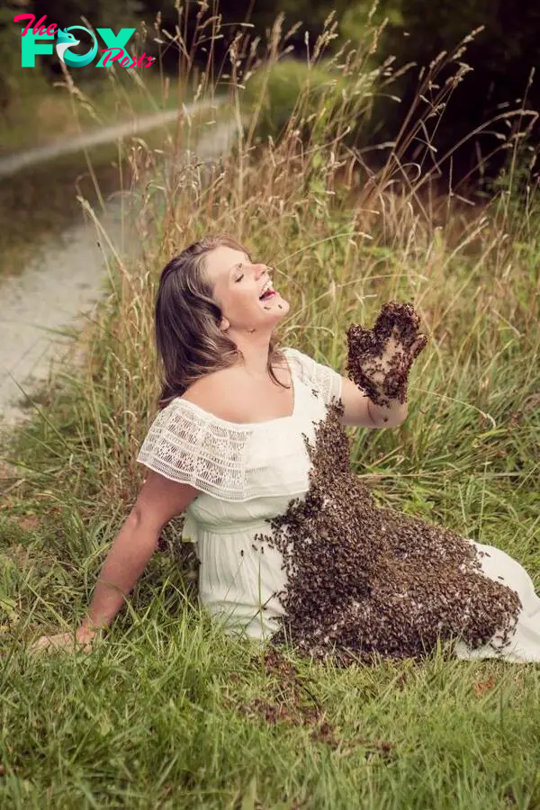  Emily Mueller, 33, from Ohio, was stung three times during the unusual shoot and held the queen bee in a cage on her stomach