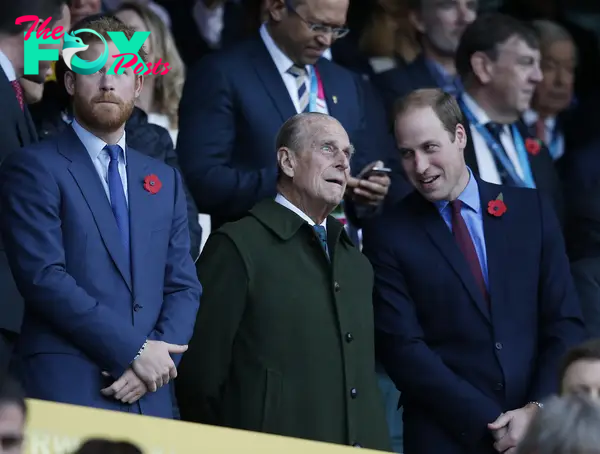 Princes Harry and William with their grandfather, Prince Philip at the Rugby World Cup final in 2015.
