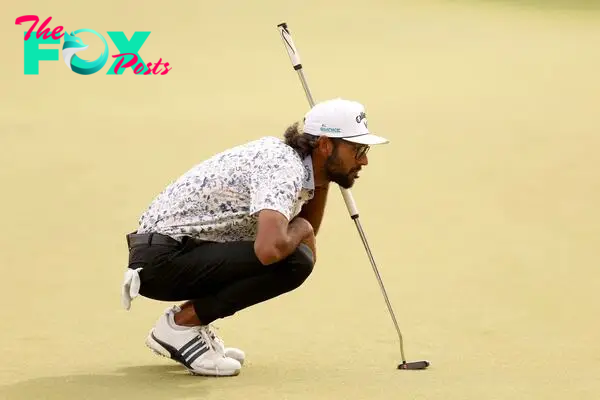 Akshay Bhatia of the United States prepares to play his put shot on the 18th hole during the third round of the Valero Texas Open 