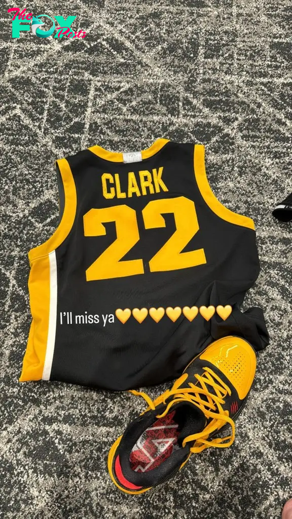 Caitlin Clark's uniform and basketball shoes. 