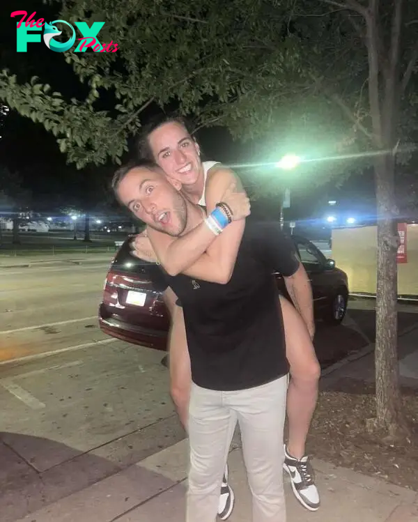 Connor McCaffrey and Connor McCaffrey hugging. 