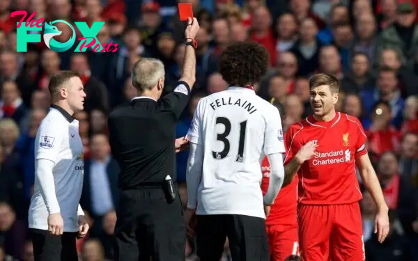 LIVERPOOL, ENGLAND - Sunday, March 22, 2015: Liverpool's captain Steven Gerrard reacts after being fouled by Manchester United's Ander Herrera, but is amazingly shown the red card by referee Martin Atkinson during the Premier League match at Anfield. (Pic by David Rawcliffe/Propaganda)