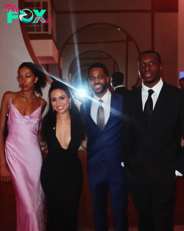 Aoki Lee Simmons posing with friends at a gala