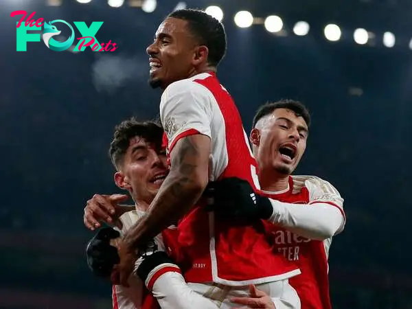 Arsenal's German midfielder #29 Kai Havertz (L) celebrates scoring his team's first goal with Arsenal's Brazilian striker #09 Gabriel Jesus (C) during the UEFA Champions League Group B football match between Arsenal and RC Lens at the Arsenal Stadium in north London on November 29, 2023. (Photo by Ian Kington / AFP)