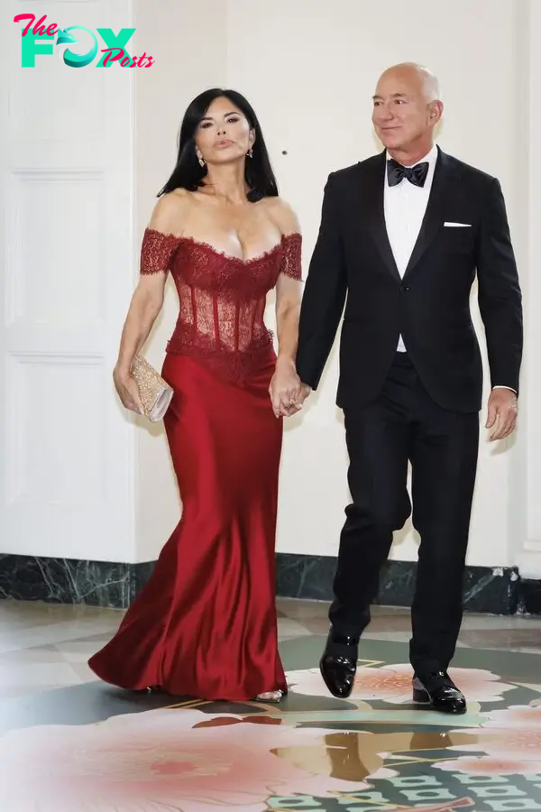 Jeff Bezos and Lauren Sanchez arrive to attend a state dinner.