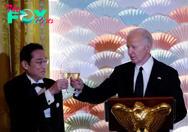U.S. President Joe Biden and Japan's Prime Minister Fumio Kishida toast.