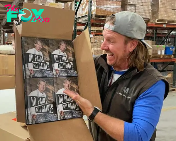 Chip Gaines with his book