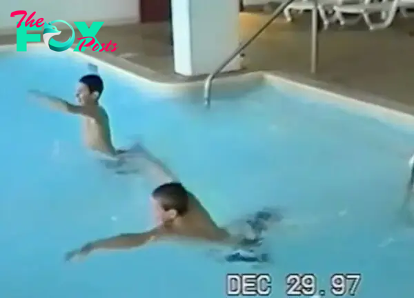 Travis and Jason Kelce swimming together as kids. 