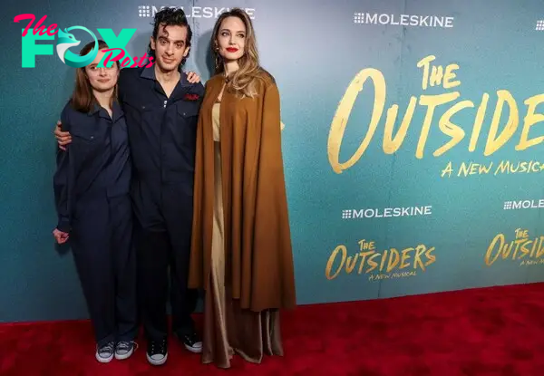 Vivienne Jolie-Pitt, Justin Levine and Angelina Jolie at the opening night of "The Outsiders"