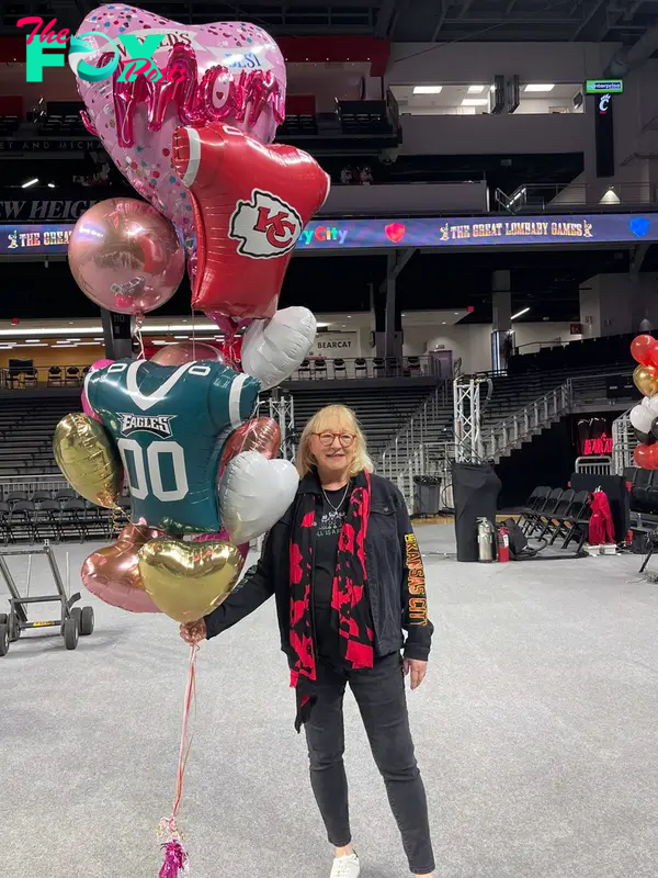 Donna Kelce holding balloons.