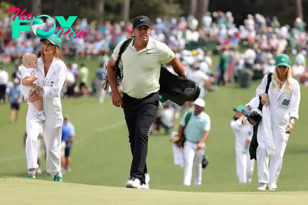 AUGUSTA, GEORGIA - APRIL 10: Brooks Koepka of the United States walks to the second green with wife, Jena Sims, during the Par Three Contest prior to the 2024 Masters Tournament at Augusta National Golf Club on April 10, 2024 in Augusta, Georgia.   Jamie Squire/Getty Images/AFP (Photo by Jamie Squire/Getty Images) (Photo by JAMIE SQUIRE / GETTY IMAGES NORTH AMERICA / Getty Images via AFP)