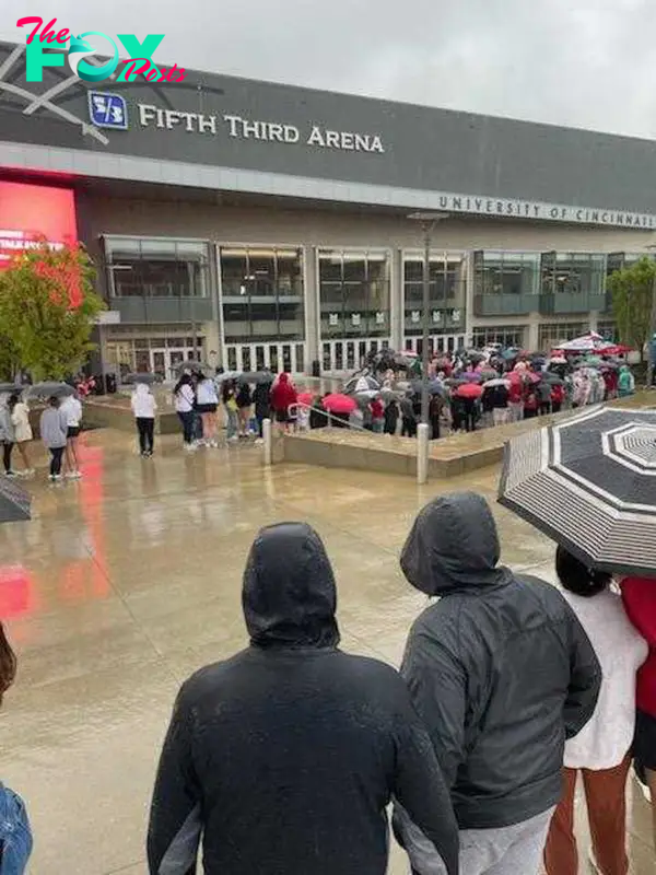 Fans outside of Fifth Third Arena in the rain.
