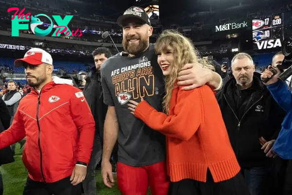 taylor swift and travis kelce on the football field
