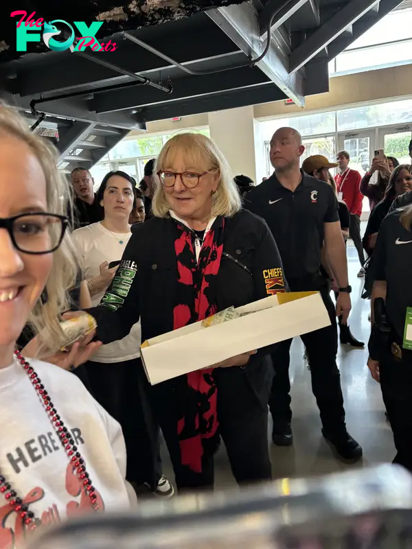 Donna Kelce giving out sandwiches.