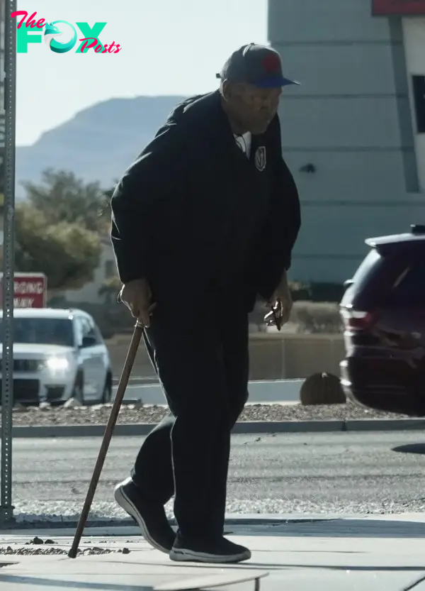 OJ Simpson walking with a cane.