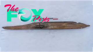 A wooden ski in the snow