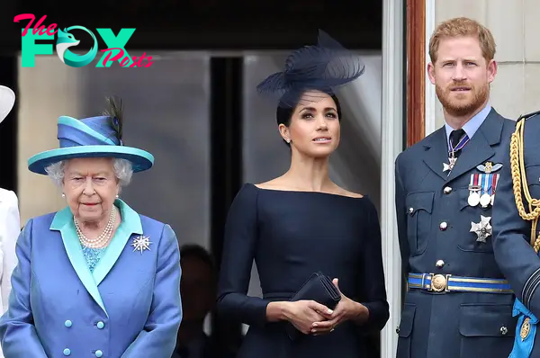 Queen Elizabeth II, Meghan Markle, and Prince Harry at Buckingham Palace as the Royal family attend events to mark the Centenary of the RAF on July 10, 2018 in London, England | Source: Getty Images