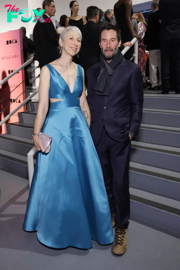 Alexandra Grant and Keanu Reeves posing together 
