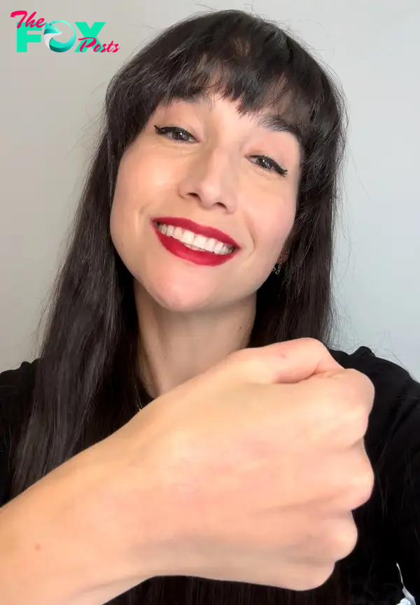 The author wearing Pat McGrath red lipstick