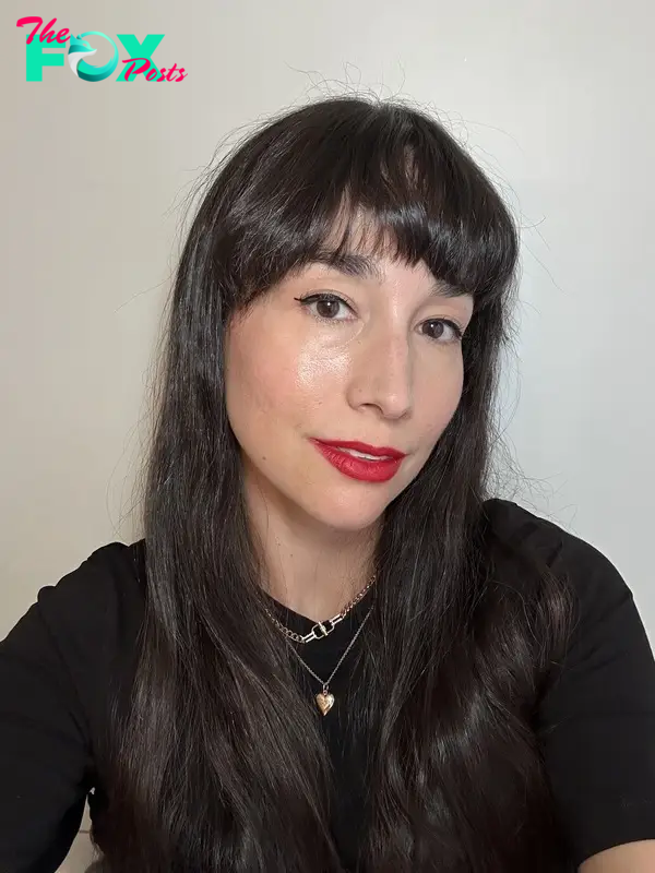 The author wearing Pat McGrath red lipstick