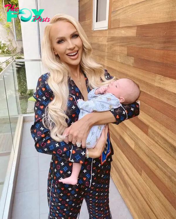 Christine Quinn holding her baby.