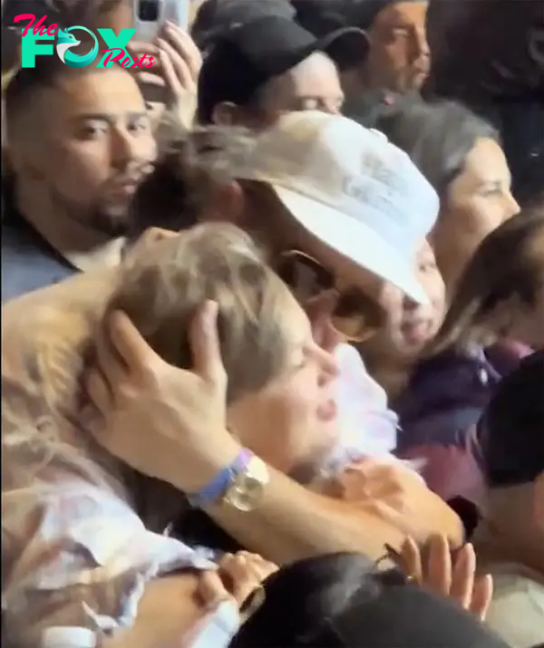 Taylor Swift and Travis Kelce hugging at Coachella.