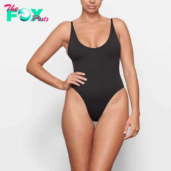 A model in a black one piece