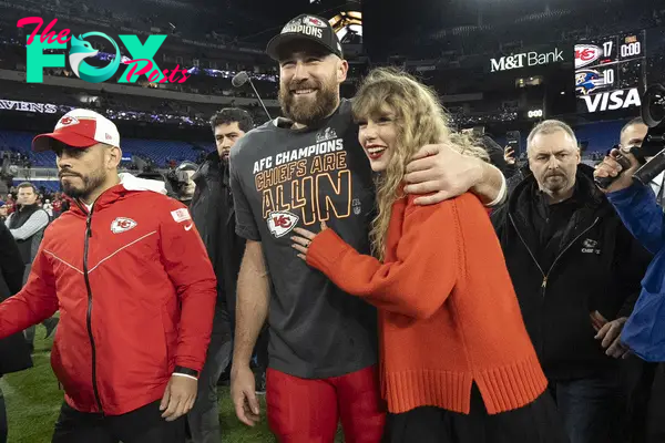 taylor swift and travis kelce on the football field