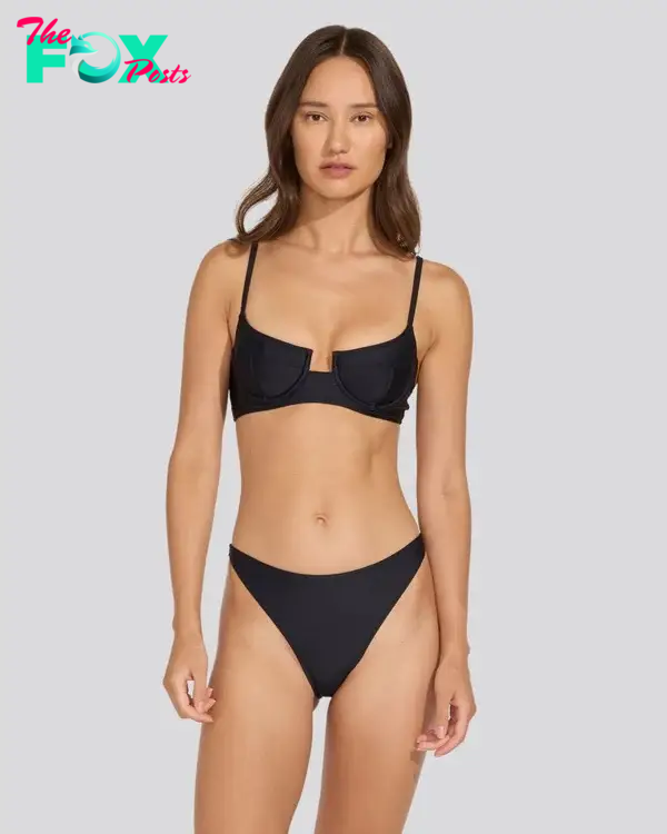 A model in a black bikini