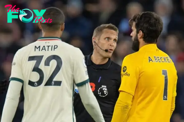 LONDON, ENGLAND - Sunday, November 7, 2021: Referee Craig Pawson speaks with goalkeeper Alisson Becker after awarding West Ham United's opening goal during the FA Premier League match between West Ham United FC and Liverpool FC at the London Stadium. West Ham United won 3-2. (Pic by David Rawcliffe/Propaganda)