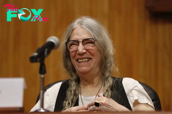 Patti Smith laughing in 2024.
