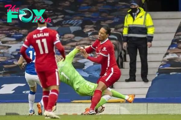 LIVERPOOL, ENGLAND - Saturday, October 17, 2020: Liverpool’s Virgil van Dijk is fouled by Everton's goalkeeper Jordan Pickford during the FA Premier League match between Everton FC and Liverpool FC, the 237th Merseyside Derby, at Goodison Park. The game was played behind closed doors due to the UK government’s social distancing laws during the Coronavirus COVID-19 Pandemic. (Pic by David Rawcliffe/Propaganda)