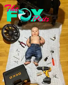 This may contain: a baby laying on top of a blanket next to tools