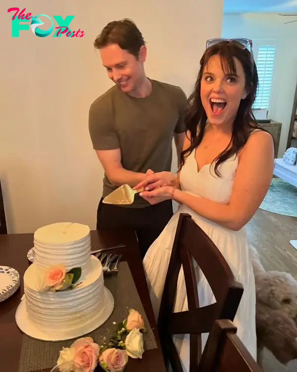 Kimberly J. Brown and Daniel Kountz cutting cake.