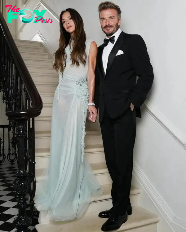 Victoria Beckham and David Beckham pose before her 50th birthday party 