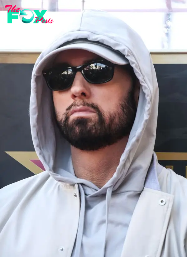 Eminem wearing glasses.