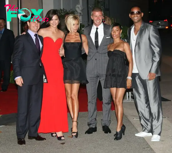 Tom Cruise, Katie Holmes, Victoria Beckham, David Beckham, Jada Pinkett Smith and Will Smith stand together.