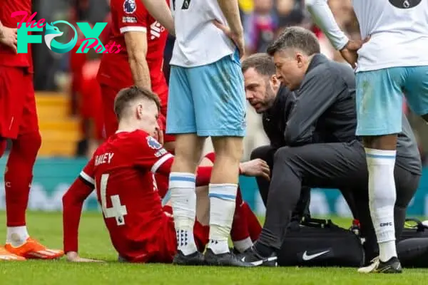 LIVERPOOL, ENGLAND - Sunday, April 14, 2024: Liverpool's Conor Bradley is treated for an injury during the FA Premier League match between Liverpool FC and Crystal Palace FC at Anfield. (Photo by David Rawcliffe/Propaganda)