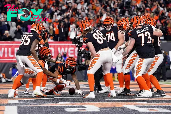 Ja'Marr Chase #1 of the Cincinnati Bengals celebrates with his teammates after scoring a 7 yard touchdown against the Baltimore Ravens during the second quarter in the AFC Wild Card playoff game at Paycor Stadium on January 15, 2023 in Cincinnati, Ohio.   Dylan Buell/Getty Images/AFP (Photo by Dylan Buell / GETTY IMAGES NORTH AMERICA / Getty Images via AFP)