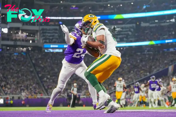 Dec 31, 2023; Minneapolis, Minnesota, USA; Green Bay Packers wide receiver Bo Melton (80) catches a pass for a touchdown against the Minnesota Vikings in the third quarter at U.S. Bank Stadium. Mandatory Credit: Brad Rempel-USA TODAY Sports