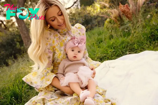 Paris Hilton with daughter London on a picnic blanket. 