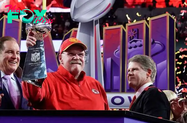 (FILES) Kansas City Chiefs' head coach Andy Reid (C) holds the trophy next to Kansas City Chiefs' owner, chairman and CEO Clark Hunt (R) as they celebrate winning Super Bowl LVIII against the San Francisco 49ers at Allegiant Stadium in Las Vegas, Nevada, February 11, 2024. Kansas City Chiefs head coach Andy Reid, general manager Brett Veach and team president Mark Donovan have received long-term contract extensions, the reigning Super Bowl champions announced on the night of April 22, 2024. (Photo by TIMOTHY A. CLARY / AFP)
